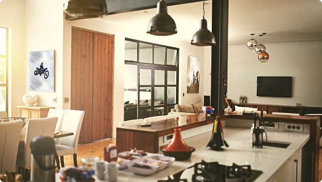 Stylish and spacious kitchen with hanging lights above a kitchen island